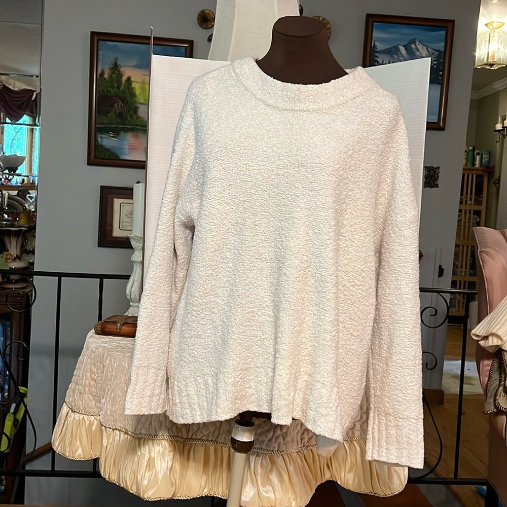 2 tops one is off while and one is beige.